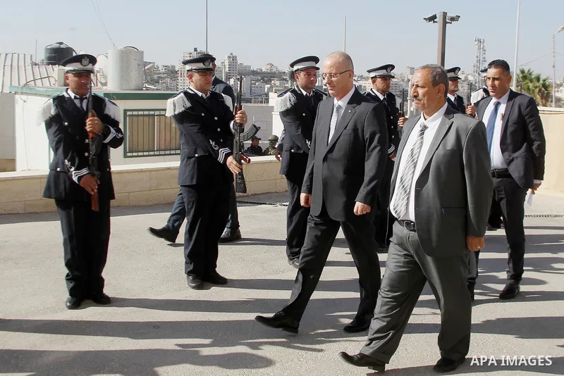 Palestinian Prime Minister Rami Hamdallah arrives before a meeting with Palestinian security chiefs in the West Bank city of Hebron on September 18, 2017. Photo by Wisam Hashlamoun