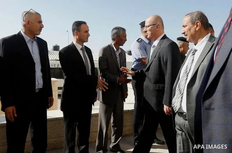 Palestinian Prime Minister Rami Hamdallah arrives before a meeting with Palestinian security chiefs in the West Bank city of Hebron on September 18, 2017. Photo by Wisam Hashlamoun