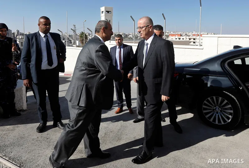 Palestinian Prime Minister Rami Hamdallah arrives before a meeting with Palestinian security chiefs in the West Bank city of Hebron on September 18, 2017. Photo by Wisam Hashlamoun