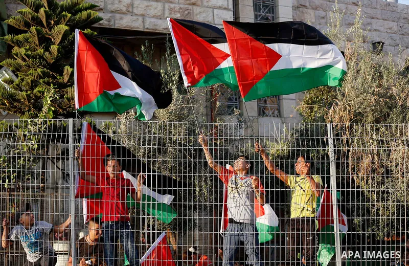 Palestinian protesters take part in a demonstration in the West Bank city of Hebron on September 18, 2017. Israel has given Jewish settlement enclaves in the occupied West Bank city of Hebron the authority to manage thei...
