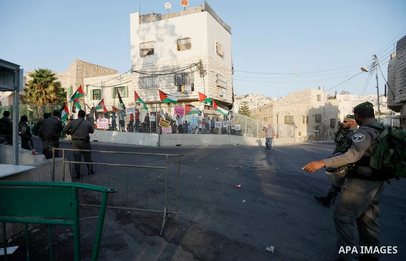 Israeli security forces stand guard during a demonstration by Palestinians in the West Bank city of Hebron on September 18, 2017. Israel has given Jewish settlement enclaves in the occupied West Bank city of Hebron the a...
