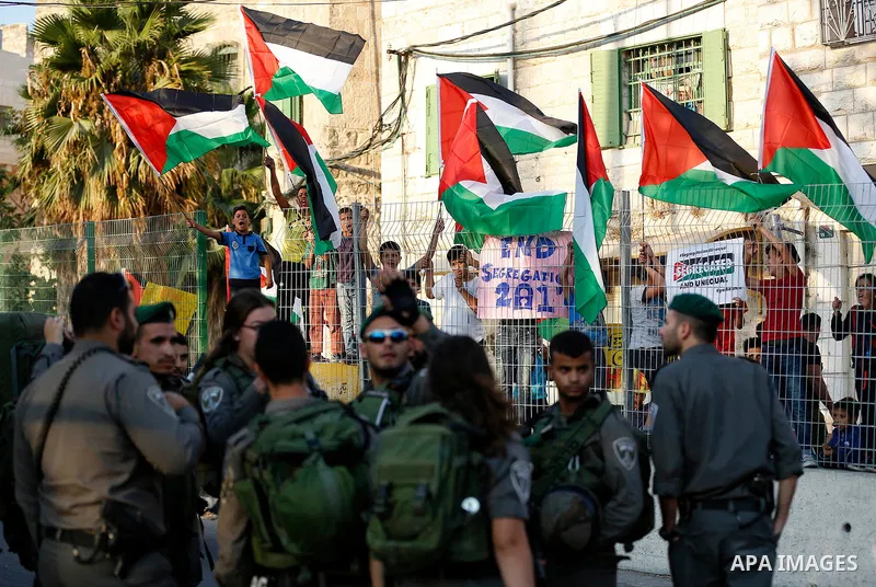 Israeli security forces stand guard during a demonstration by Palestinians in the West Bank city of Hebron on September 18, 2017. Israel has given Jewish settlement enclaves in the occupied West Bank city of Hebron the a...