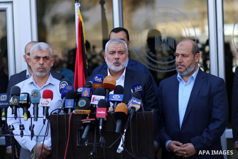 Hamas Chief Ismail Haniyeh speaks to the press upon his arrival on the Palestinian side of the Rafah border crossing, in the southern Gaza Strip on September 19, 2017. Haniyeh said on Tuesday evening that his movement is...