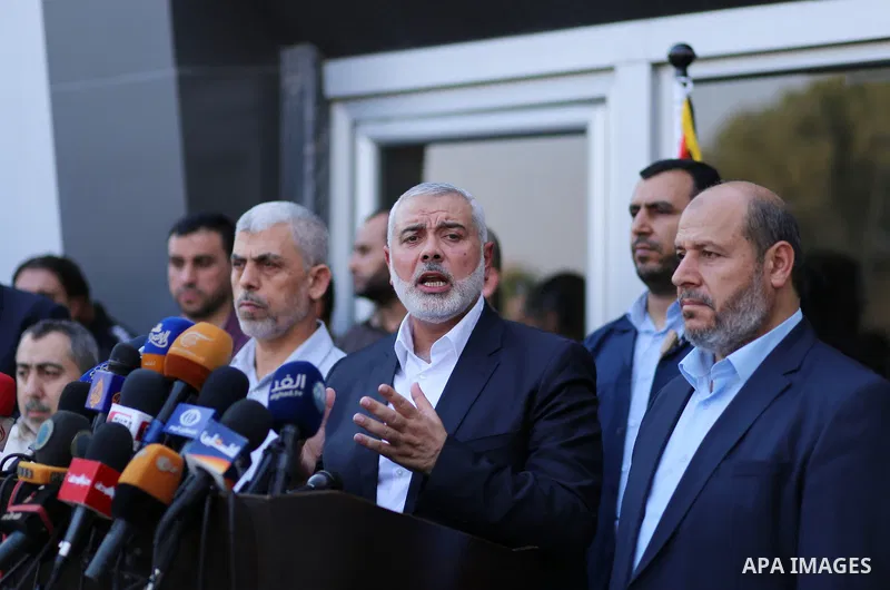 Hamas Chief Ismail Haniyeh speaks to the press upon his arrival on the Palestinian side of the Rafah border crossing, in the southern Gaza Strip on September 19, 2017. Haniyeh said on Tuesday evening that his movement is...