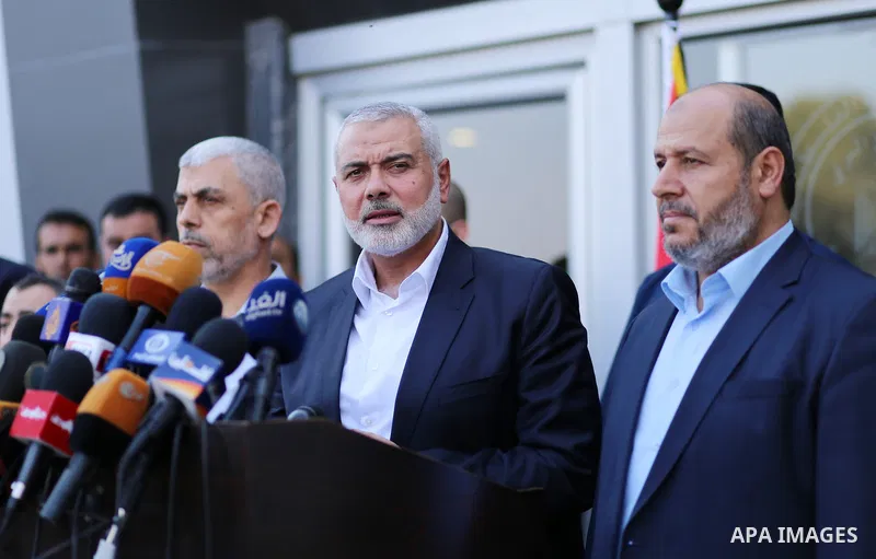 Hamas Chief Ismail Haniyeh speaks to the press upon his arrival on the Palestinian side of the Rafah border crossing, in the southern Gaza Strip on September 19, 2017. Haniyeh said on Tuesday evening that his movement is...