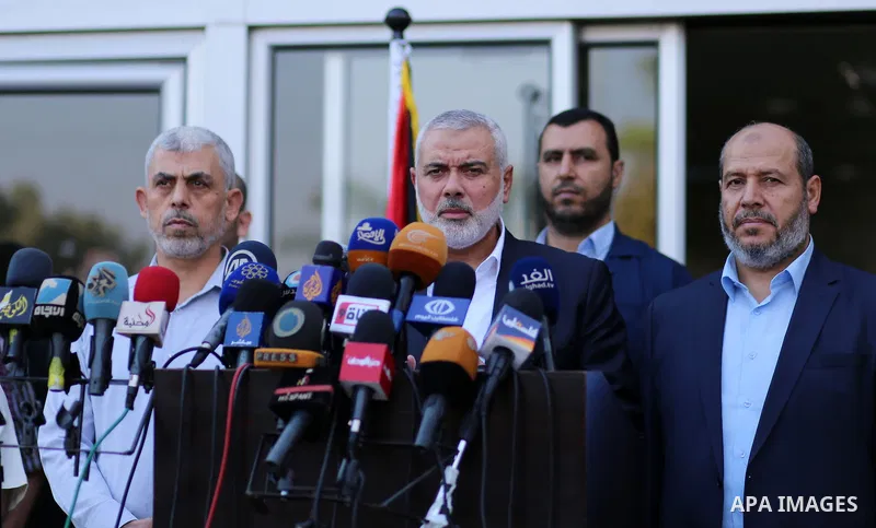 Hamas Chief Ismail Haniyeh speaks to the press upon his arrival on the Palestinian side of the Rafah border crossing, in the southern Gaza Strip on September 19, 2017. Haniyeh said on Tuesday evening that his movement is...