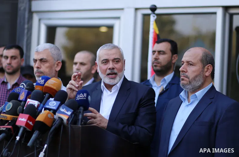 Hamas Chief Ismail Haniyeh speaks to the press upon his arrival on the Palestinian side of the Rafah border crossing, in the southern Gaza Strip on September 19, 2017. Haniyeh said on Tuesday evening that his movement is...