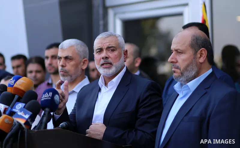 Hamas Chief Ismail Haniyeh speaks to the press upon his arrival on the Palestinian side of the Rafah border crossing, in the southern Gaza Strip on September 19, 2017. Haniyeh said on Tuesday evening that his movement is...