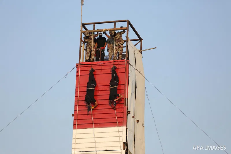 Palestinian militants of al-Nasser Salah al-Deen Brigades, the military wing of the Popular Resistance Committees, take part in a training exercise in Khan Younis in the southern Gaza Strip on September 19, 2017. Photo b...