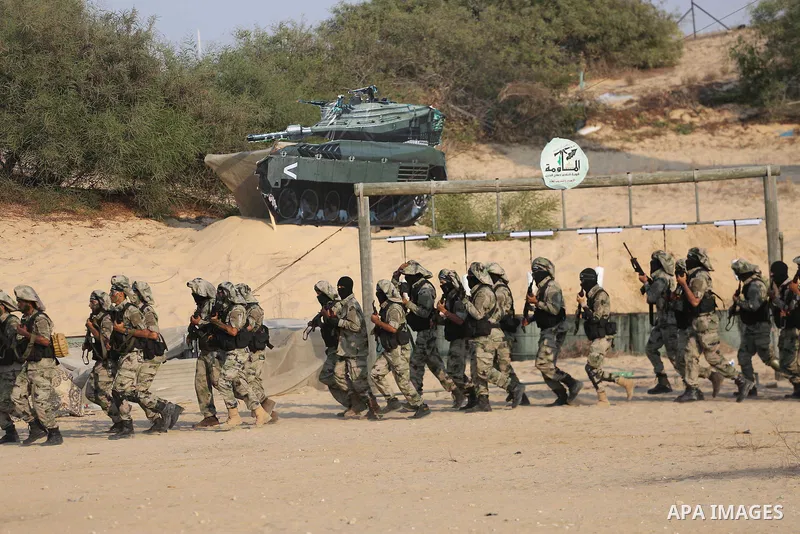 Palestinian militants of al-Nasser Salah al-Deen Brigades, the military wing of the Popular Resistance Committees, take part in a training exercise in Khan Younis in the southern Gaza Strip on September 19, 2017. Photo b...