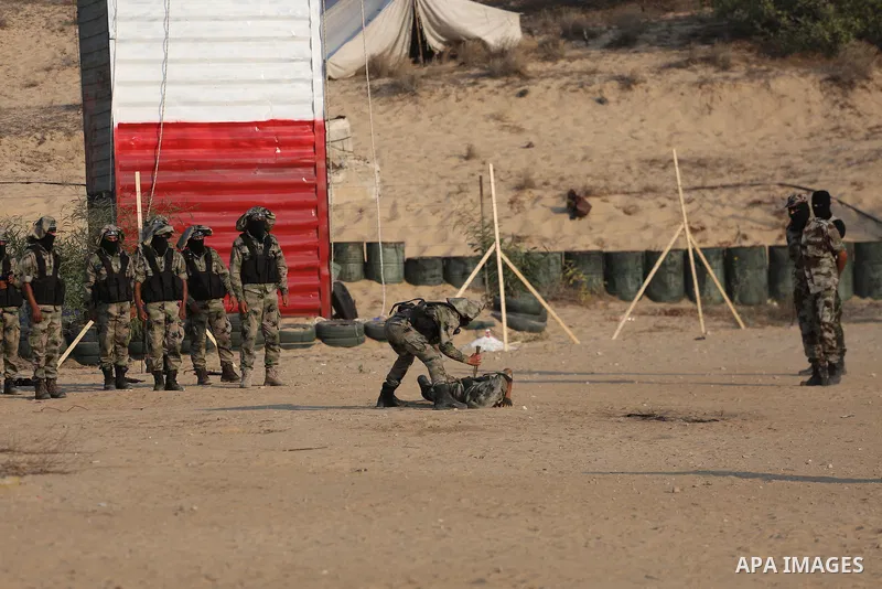 Palestinian militants of al-Nasser Salah al-Deen Brigades, the military wing of the Popular Resistance Committees, take part in a training exercise in Khan Younis in the southern Gaza Strip on September 19, 2017. Photo b...