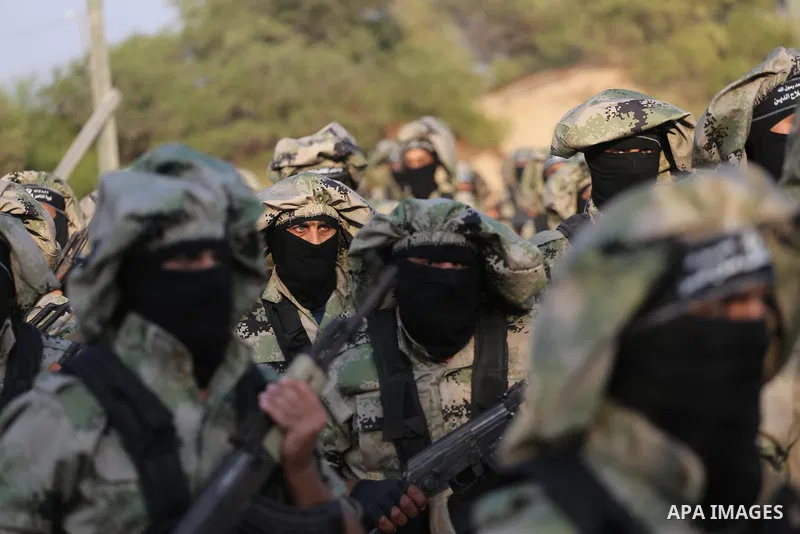 Palestinian militants of al-Nasser Salah al-Deen Brigades, the military wing of the Popular Resistance Committees, take part in a training exercise in Khan Younis in the southern Gaza Strip on September 19, 2017. Photo b...