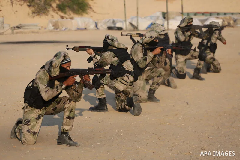Palestinian militants of al-Nasser Salah al-Deen Brigades, the military wing of the Popular Resistance Committees, take part in a training exercise in Khan Younis in the southern Gaza Strip on September 19, 2017. Photo b...