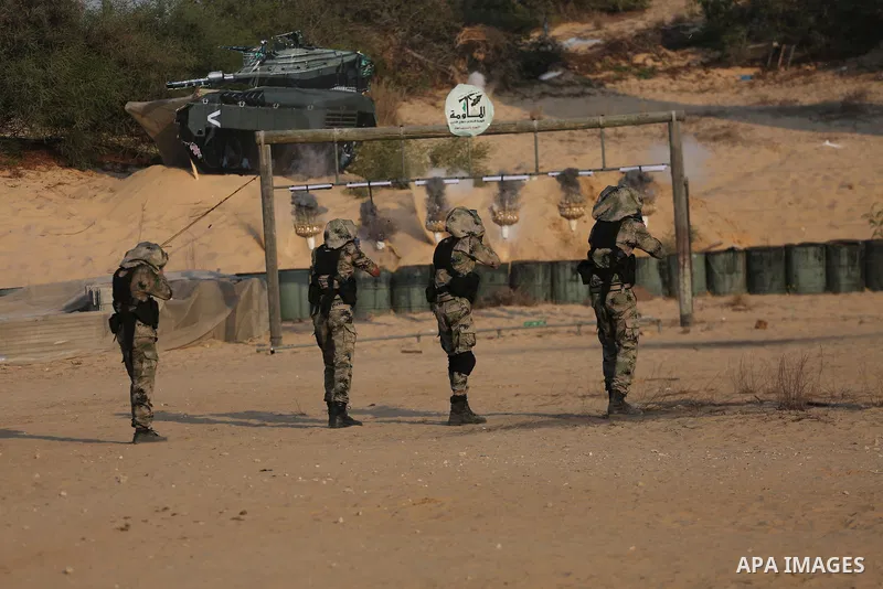 Palestinian militants of al-Nasser Salah al-Deen Brigades, the military wing of the Popular Resistance Committees, take part in a training exercise in Khan Younis in the southern Gaza Strip on September 19, 2017. Photo b...