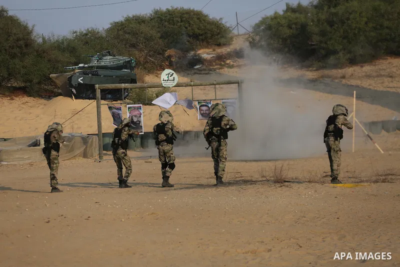 Palestinian militants of al-Nasser Salah al-Deen Brigades, the military wing of the Popular Resistance Committees, take part in a training exercise in Khan Younis in the southern Gaza Strip on September 19, 2017. Photo b...