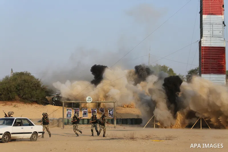 Palestinian militants of al-Nasser Salah al-Deen Brigades, the military wing of the Popular Resistance Committees, take part in a training exercise in Khan Younis in the southern Gaza Strip on September 19, 2017. Photo b...
