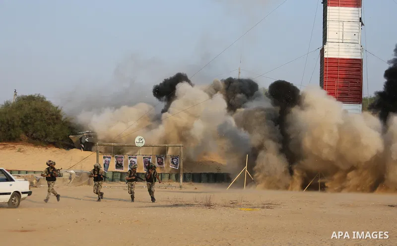 Palestinian militants of al-Nasser Salah al-Deen Brigades, the military wing of the Popular Resistance Committees, take part in a training exercise in Khan Younis in the southern Gaza Strip on September 19, 2017. Photo b...