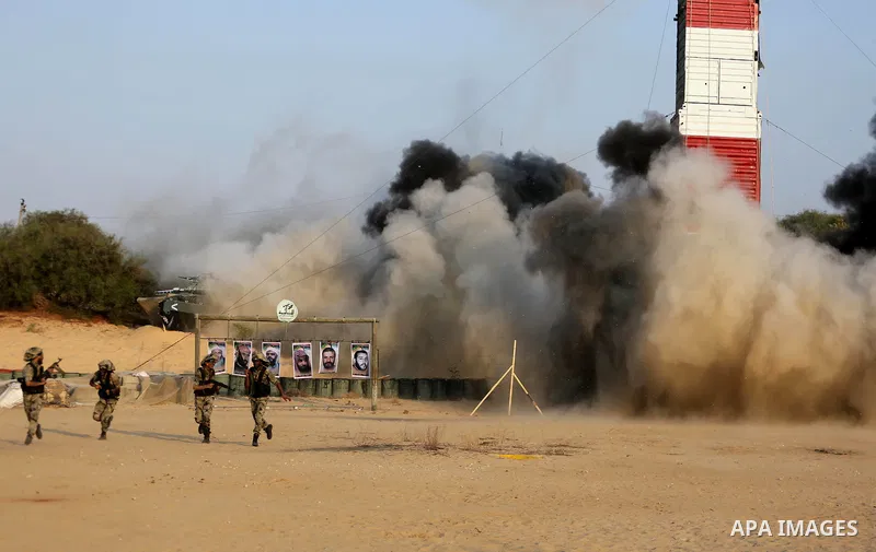 Palestinian militants of al-Nasser Salah al-Deen Brigades, the military wing of the Popular Resistance Committees, take part in a training exercise in Khan Younis in the southern Gaza Strip on September 19, 2017. Photo b...