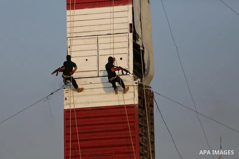 Palestinian militants of al-Nasser Salah al-Deen Brigades, the military wing of the Popular Resistance Committees, take part in a training exercise in Khan Younis in the southern Gaza Strip on September 19, 2017. Photo b...
