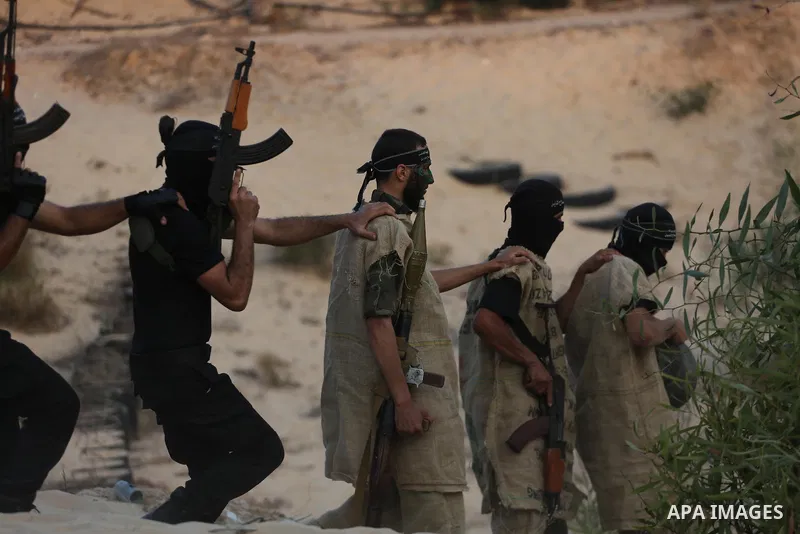 Palestinian militants of al-Nasser Salah al-Deen Brigades, the military wing of the Popular Resistance Committees, take part in a training exercise in Khan Younis in the southern Gaza Strip on September 19, 2017. Photo b...