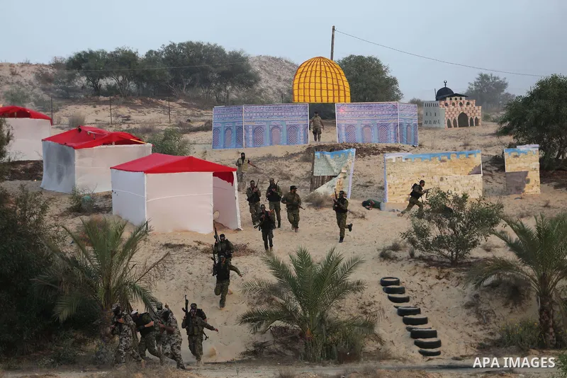 Palestinian militants of al-Nasser Salah al-Deen Brigades, the military wing of the Popular Resistance Committees, take part in a training exercise in Khan Younis in the southern Gaza Strip on September 19, 2017. Photo b...