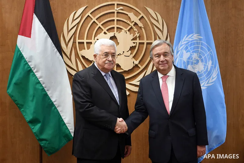 Palestinian President Mahmoud Abbas is greeted by United Nations Secretary-General Antonio Guterres at U.N. Headquarters in Manhattan, New York, U.S., September 19, 2017. Photo by Thaer Ghanaim