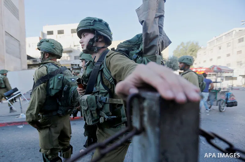 Israeli security forces take position after soldiers entered an area controlled by the Palestinian authority in the divided city of Hebron, in the Israeli-occupied West Bank, on September 20, 2017. Photo by Wisam Hashlam...