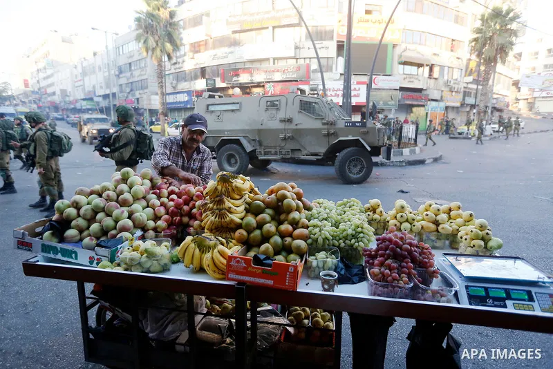Israeli security forces take position after soldiers entered an area controlled by the Palestinian authority in the divided city of Hebron, in the Israeli-occupied West Bank, on September 20, 2017. Photo by Wisam Hashlam...