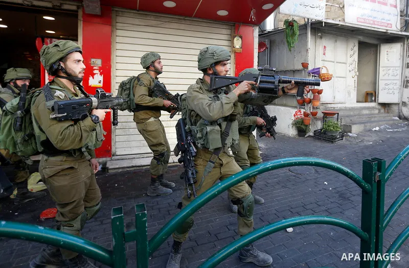 Israeli security forces take position after soldiers entered an area controlled by the Palestinian authority in the divided city of Hebron, in the Israeli-occupied West Bank, on September 20, 2017. Photo by Wisam Hashlam...