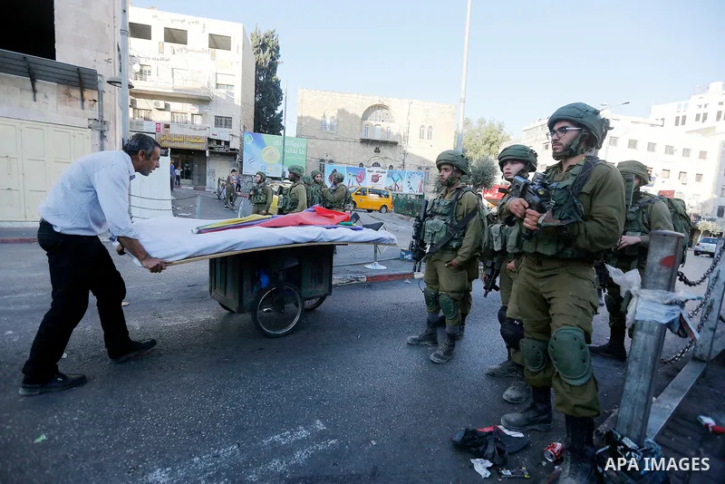 Israeli security forces take position after soldiers entered an area controlled by the Palestinian authority in the divided city of Hebron, in the Israeli-occupied West Bank, on September 20, 2017. Photo by Wisam Hashlam...