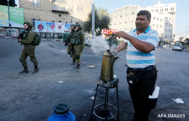 Israeli security forces take position after soldiers entered an area controlled by the Palestinian authority in the divided city of Hebron, in the Israeli-occupied West Bank, on September 20, 2017. Photo by Wisam Hashlam...