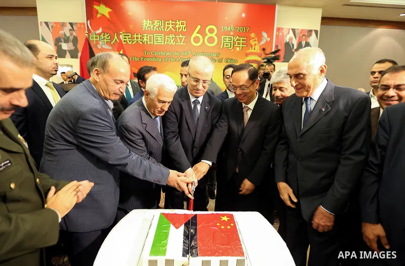 Palestinian Prime Minister Rami Hamdallah take part during the ceremony of the sixty-eighth anniversary of the founding of the People's Republic of China, in the West Bank city of Ramallah on September 20, 2017. Photo by...