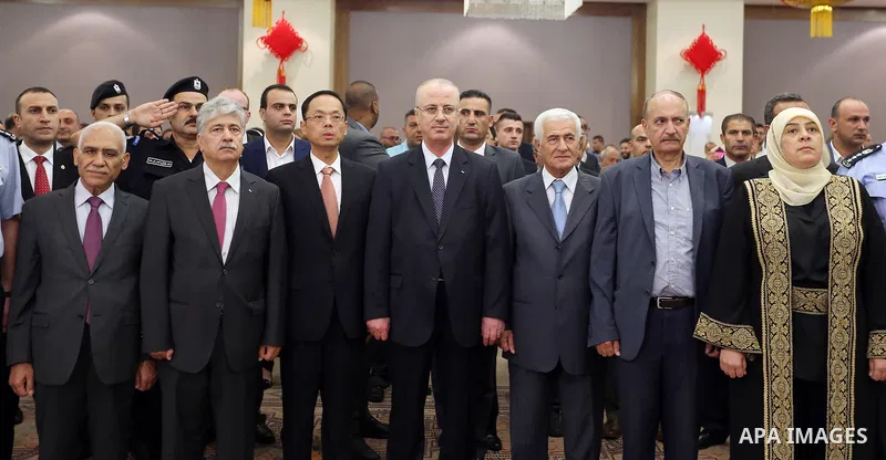 Palestinian Prime Minister Rami Hamdallah take part during the ceremony of the sixty-eighth anniversary of the founding of the People's Republic of China, in the West Bank city of Ramallah on September 20, 2017. Photo by...