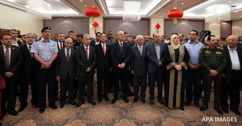 Palestinian Prime Minister Rami Hamdallah take part during the ceremony of the sixty-eighth anniversary of the founding of the People's Republic of China, in the West Bank city of Ramallah on September 20, 2017. Photo by...