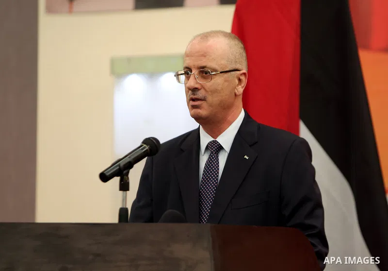 Palestinian Prime Minister Rami Hamdallah take part during the ceremony of the sixty-eighth anniversary of the founding of the People's Republic of China, in the West Bank city of Ramallah on September 20, 2017. Photo by...