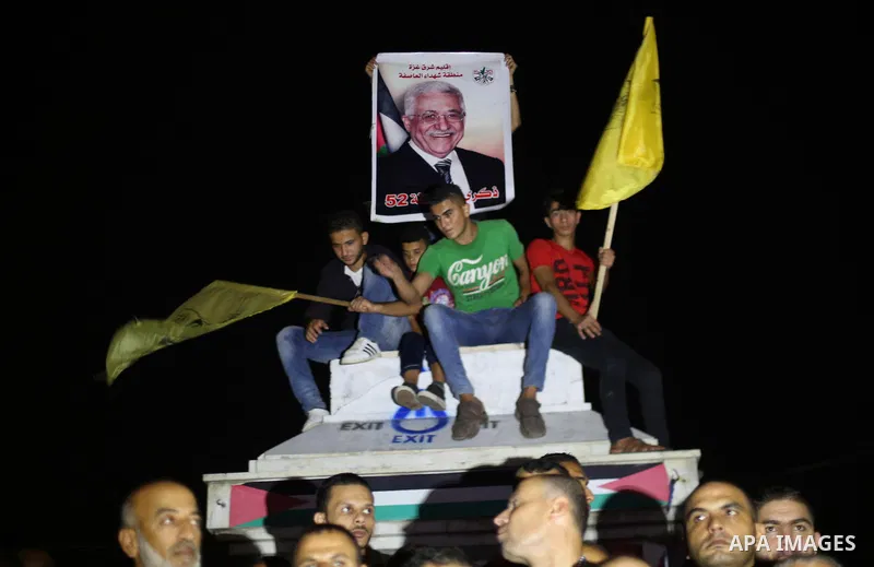 Palestinian supporters of Fateh movement and Palestinian president Mahmud Abbas (portrait) gather in Gaza City as Abbas addresses the 72nd United Nations General Assembly at the United Nations headquarters in New York on...