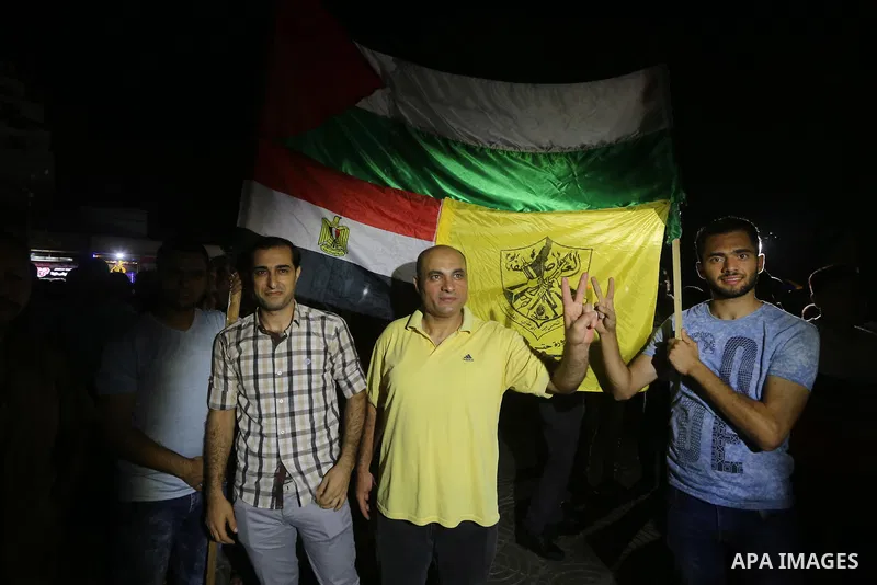Palestinian supporters of Fateh movement and Palestinian president Mahmud Abbas (portrait) gather in Gaza City as Abbas addresses the 72nd United Nations General Assembly at the United Nations headquarters in New York on...
