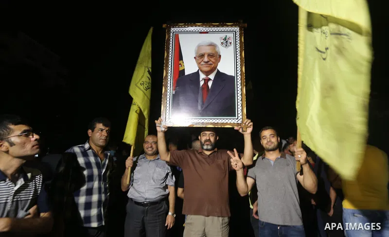 Palestinian supporters of Fateh movement and Palestinian president Mahmud Abbas (portrait) gather in Gaza City as Abbas addresses the 72nd United Nations General Assembly at the United Nations headquarters in New York on...