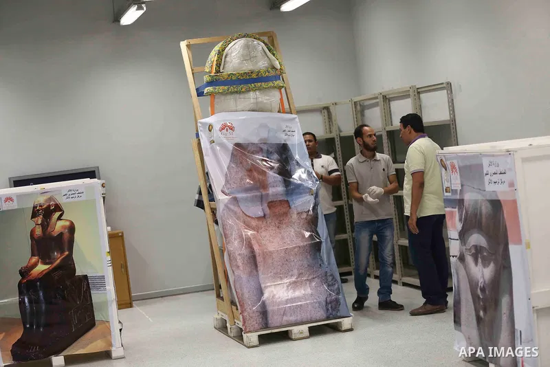 Egyptian workers transport statues upon its arrival at the restoration laboratory of the Grand Egyptian Museum (GEM) in Cairo, Egypt, on Sept. 20, 2017. A batch of statues were transported from the Egyptian Museum to the...