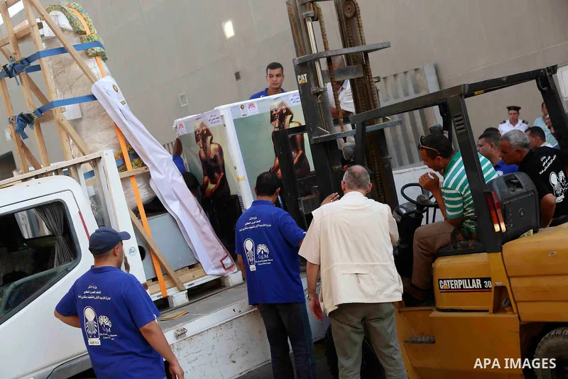 Egyptian workers transport statues upon its arrival at the restoration laboratory of the Grand Egyptian Museum (GEM) in Cairo, Egypt, on Sept. 20, 2017. A batch of statues were transported from the Egyptian Museum to the...