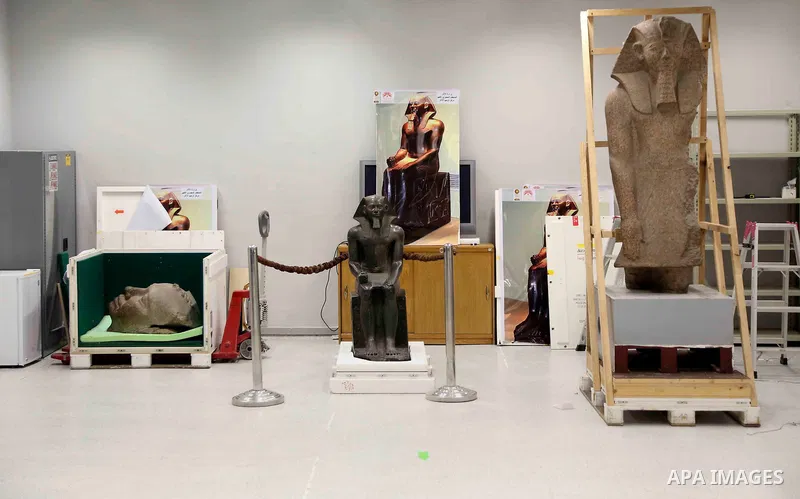 Egyptian workers transport statues upon its arrival at the restoration laboratory of the Grand Egyptian Museum (GEM) in Cairo, Egypt, on Sept. 20, 2017. A batch of statues were transported from the Egyptian Museum to the...