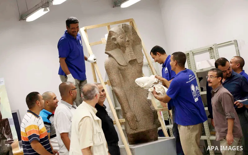 Egyptian workers transport statues upon its arrival at the restoration laboratory of the Grand Egyptian Museum (GEM) in Cairo, Egypt, on Sept. 20, 2017. A batch of statues were transported from the Egyptian Museum to the...