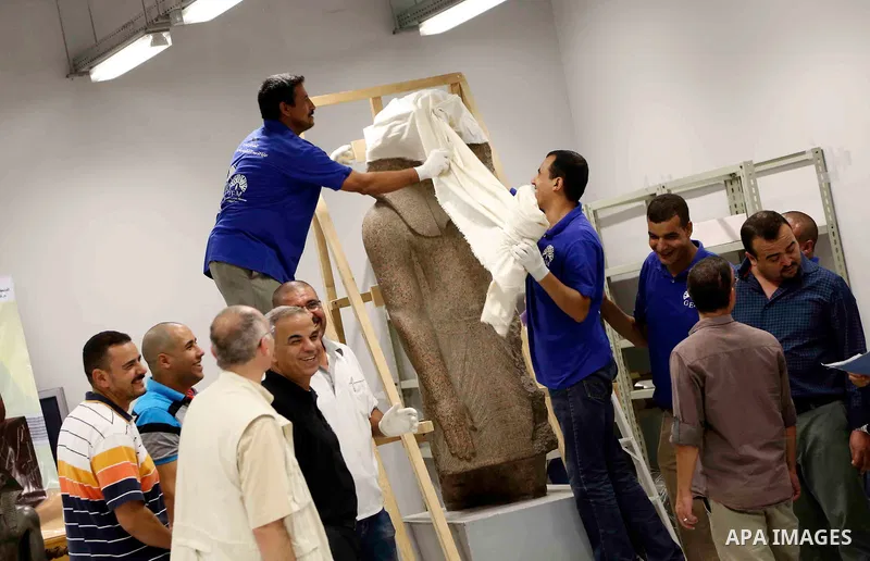 Egyptian workers transport statues upon its arrival at the restoration laboratory of the Grand Egyptian Museum (GEM) in Cairo, Egypt, on Sept. 20, 2017. A batch of statues were transported from the Egyptian Museum to the...
