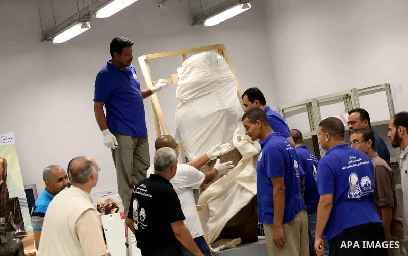 Egyptian workers transport statues upon its arrival at the restoration laboratory of the Grand Egyptian Museum (GEM) in Cairo, Egypt, on Sept. 20, 2017. A batch of statues were transported from the Egyptian Museum to the...