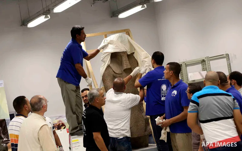 Egyptian workers transport statues upon its arrival at the restoration laboratory of the Grand Egyptian Museum (GEM) in Cairo, Egypt, on Sept. 20, 2017. A batch of statues were transported from the Egyptian Museum to the...
