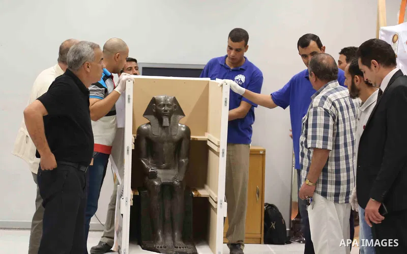 Egyptian workers transport statues upon its arrival at the restoration laboratory of the Grand Egyptian Museum (GEM) in Cairo, Egypt, on Sept. 20, 2017. A batch of statues were transported from the Egyptian Museum to the...