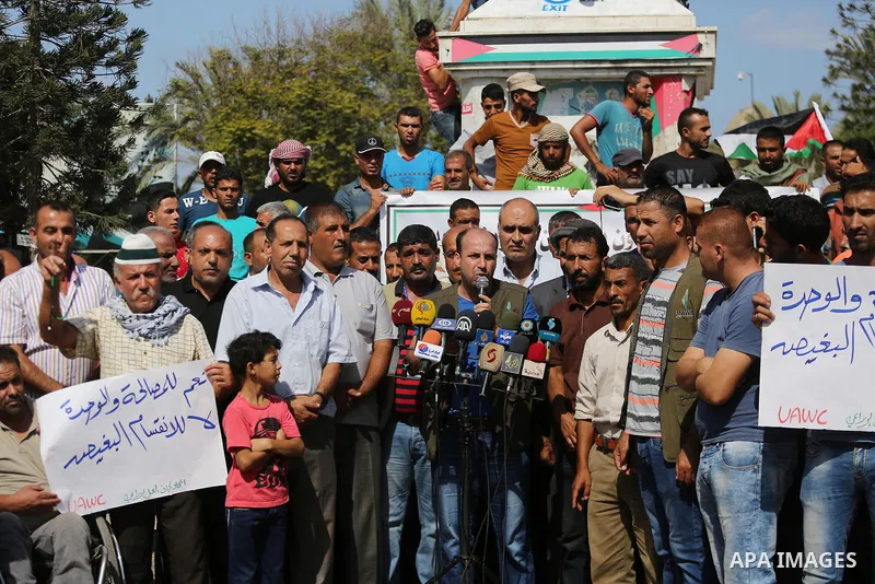 Palestinians of the Union of Agricultural Work Committees take part in a support of the Palestinian reconciliation, in Gaza city, on September 24, 2017. Palestinian President Mahmoud Abbas on Saturday said an announcemen...