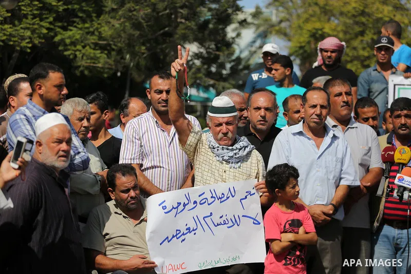 Palestinians of the Union of Agricultural Work Committees take part in a support of the Palestinian reconciliation, in Gaza city, on September 24, 2017. Palestinian President Mahmoud Abbas on Saturday said an announcemen...