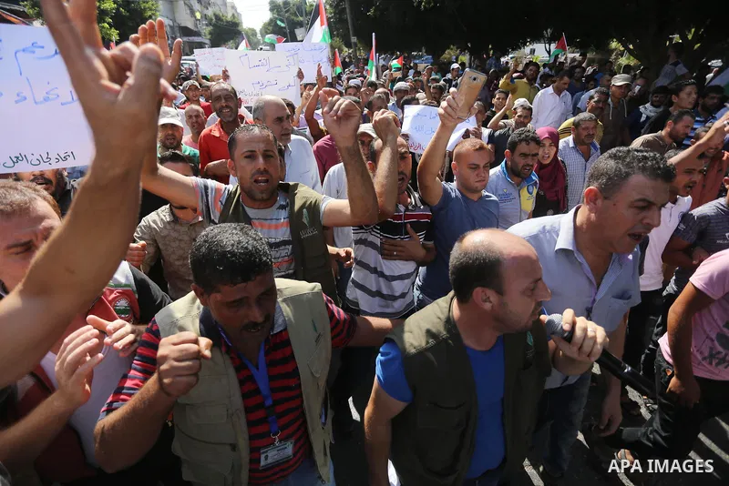 Palestinians of the Union of Agricultural Work Committees take part in a support of the Palestinian reconciliation, in Gaza city, on September 24, 2017. Palestinian President Mahmoud Abbas on Saturday said an announcemen...