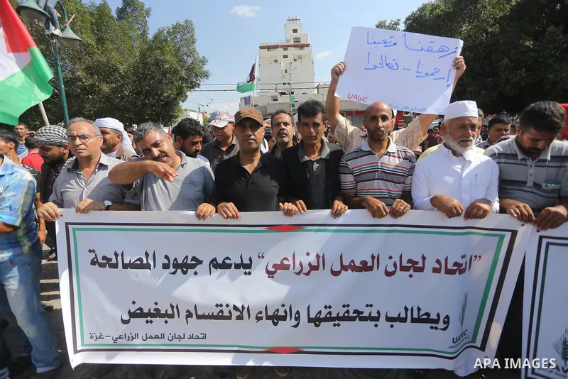 Palestinians of the Union of Agricultural Work Committees take part in a support of the Palestinian reconciliation, in Gaza city, on September 24, 2017. Palestinian President Mahmoud Abbas on Saturday said an announcemen...